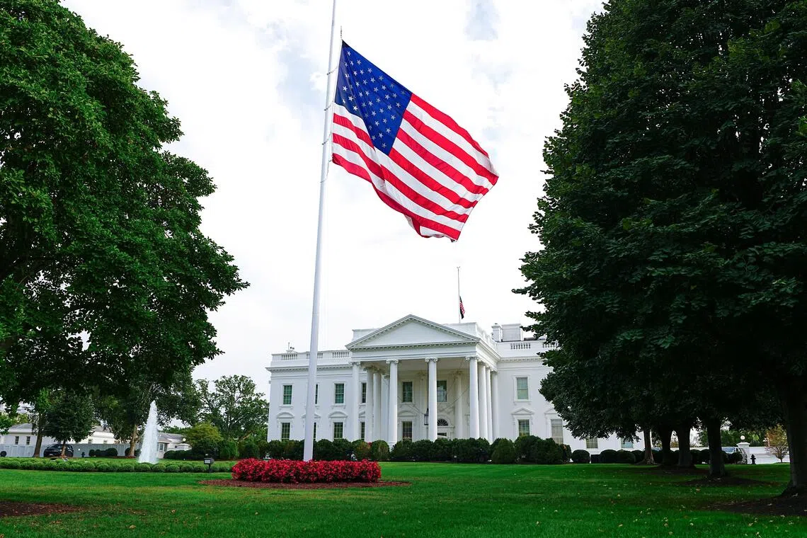 The new American flag on the North Lawn of the White House flies at half-staff in honor of Charlie Kirk, who was shot and killed during an event in Utah, in Washington, D.C., U.S., September 14, 2025. REUTERS/Aaron Schwartz