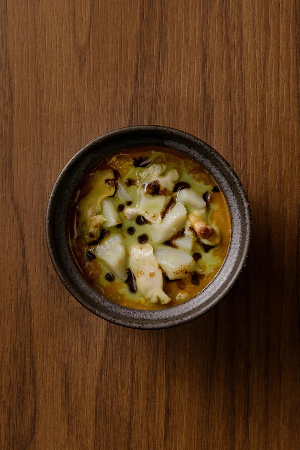 Clam chawanmushi laced with assam pedas and white pepper sauce.