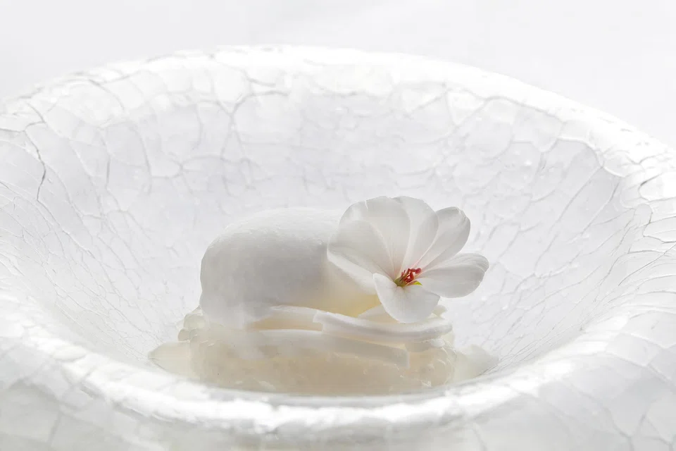 Dessert of coconut ice cream, sago and yogurt crisps.