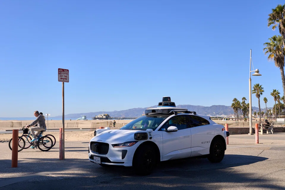 A self-driving robotaxi in Los Angeles, California. Human trust in AI is multifaceted and significantly influenced by how agentic the AI is perceived to be.