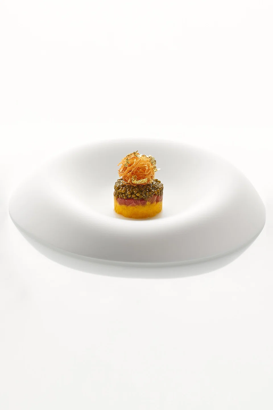 Crushed potatoes layered with chutoro, caviar and crunchy potato nest.
