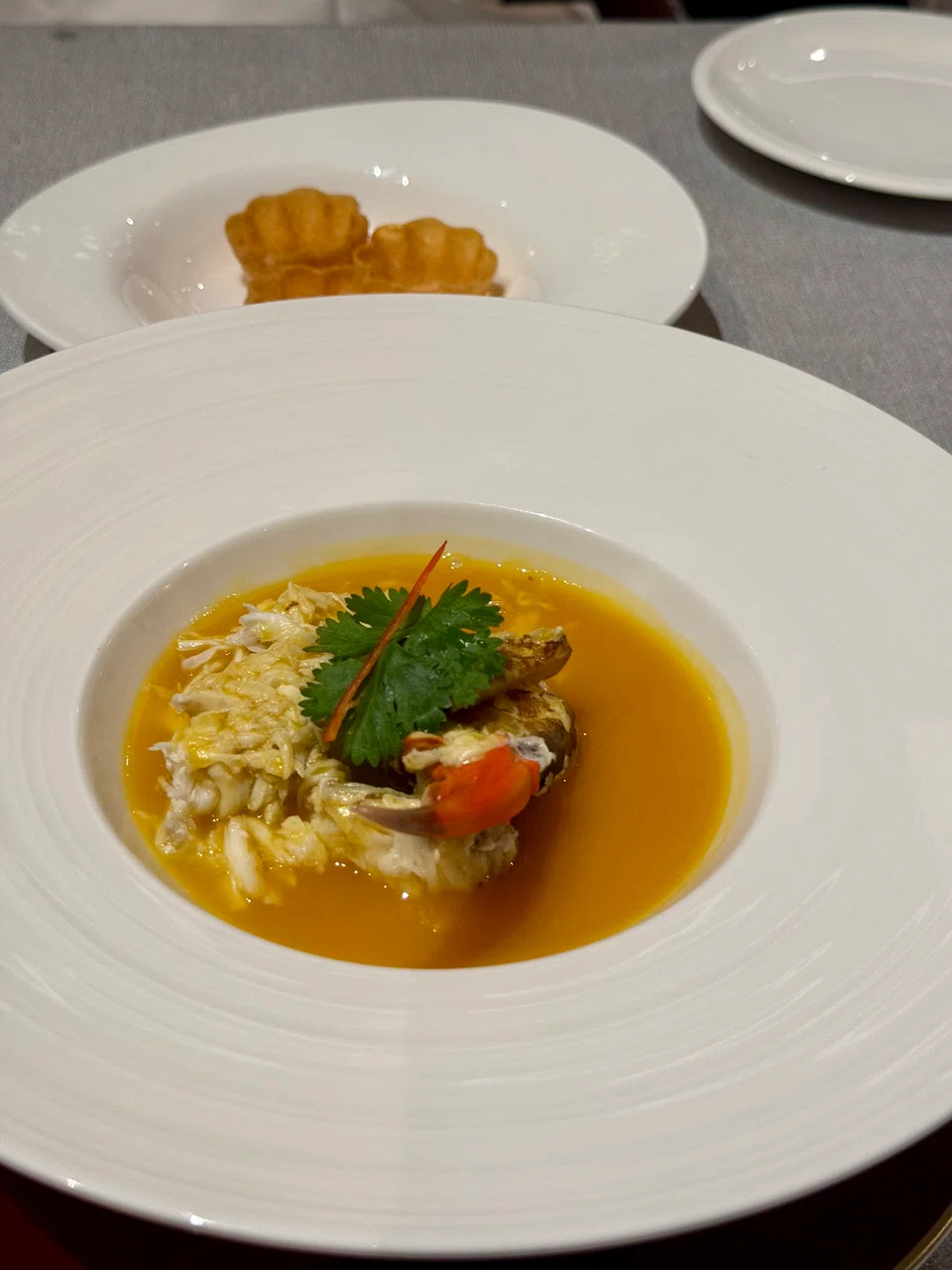 Steamed crab in custard and pumpkin broth.