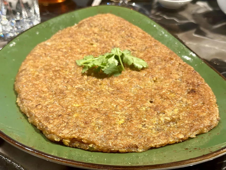 The oyster omelette is on the greasy side.