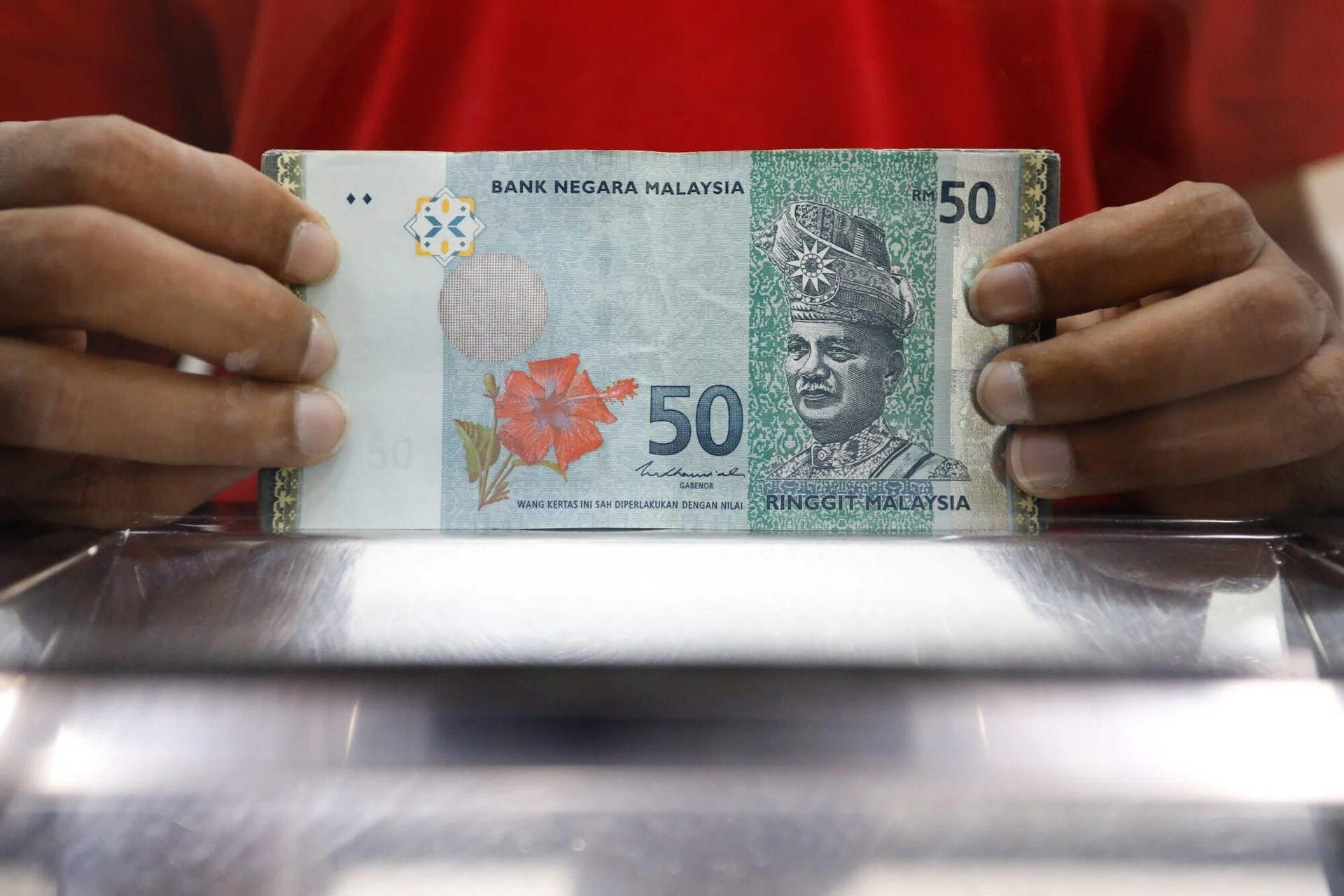 Malaysian ringgit nears one-year high on rate outlook, growth optimism