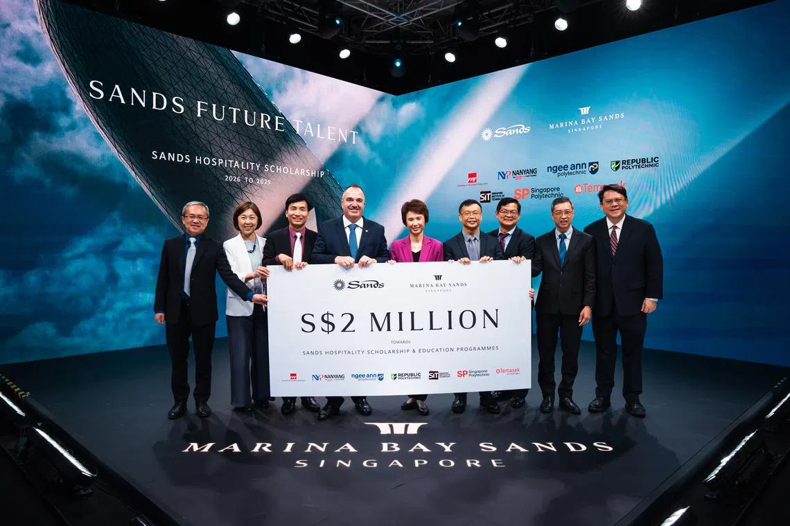 MBS chief operating officer Paul Town (fourth from left) and Senior Minister of State for Trade and Industry Low Yen Ling (fifth from left) at the Sands Future Talent Ceremony. The second iteration of the Sands Hospitality Scholarship programme will be seeded with S$2 million.
