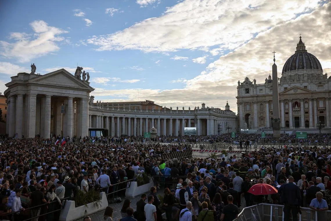 People waiting at St Peter's Square in the Vatican on May 7, the first day of the conclave to elect the new pope.