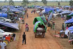 Displaced people arrive at a temporary camp in Cambodia. The unmanned aerial vehicles (UAVs) were detected flying from the Cambodian side on Sunday, intruding into Thailand’s sovereign territory.
