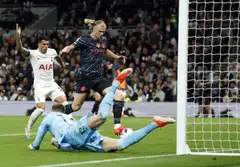 Manchester City's Erling Haaland scores their first goal past Tottenham Hotspur's Guglielmo Vicario at the Tottenham Hotspur Stadium, London, Britain, May 14, 2024