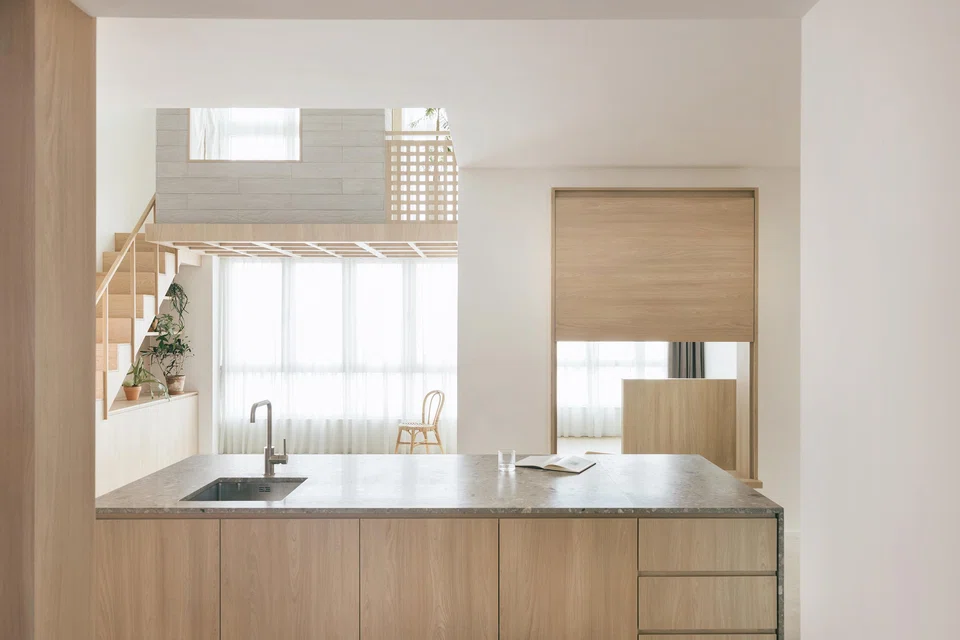 A window to the son's bedroom provides connection. 