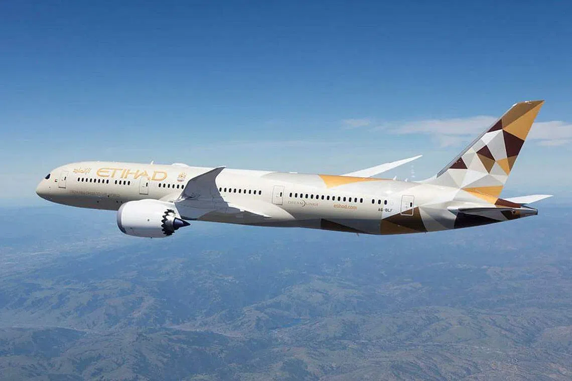 Etihad Airways loss narrows as covid curbs ebb and freight demand soars