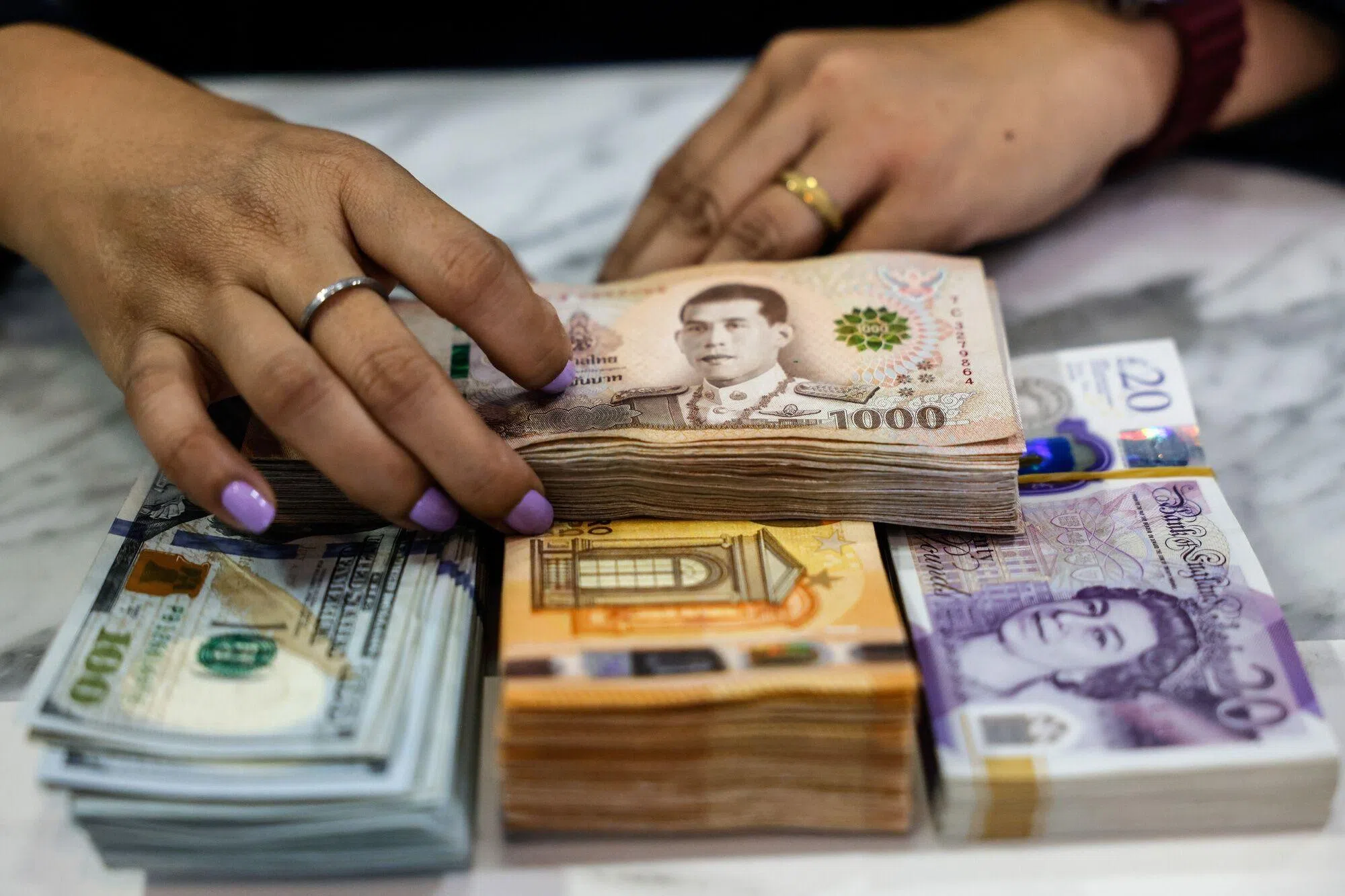 The rally has already pushed the baht to a four-year high against the US dollar in September – and at first glance, the surge is puzzling.