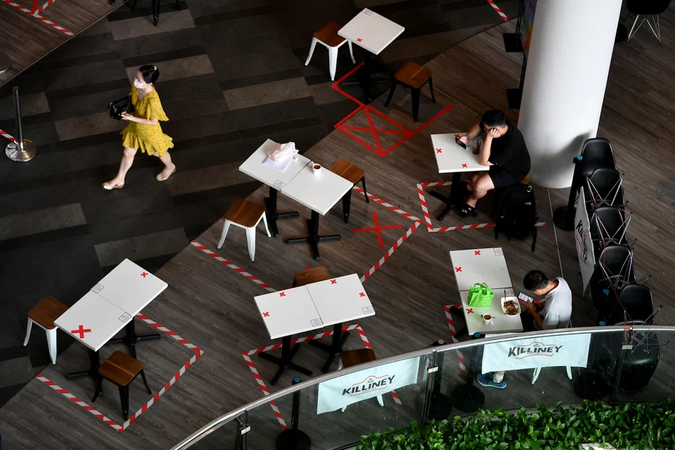 Red tape and red crosses have served as safe distancing markings when Singapore underwent a period of "heightened alert" in June 2021.