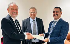 Handover of asset documents from Mr Tan to Greta Minerals MD Mr Rajshekhar, observed by Greta Group Chairman Mr. Nitesh Chaudhari.