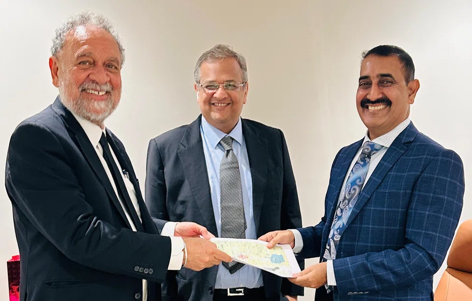 Handover of asset documents from Mr Tan to Greta Minerals MD Mr Rajshekhar, observed by Greta Group Chairman Mr. Nitesh Chaudhari.