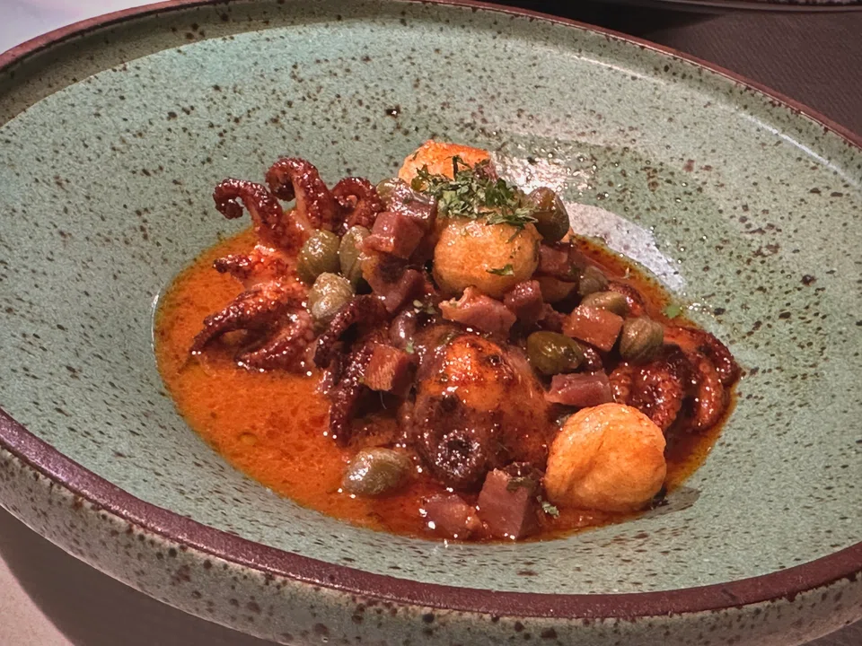 Baby octopus in a smoky paprika sauce with capers and parma ham.