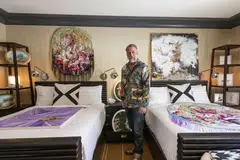 K Contemporary turned a wall piece by textile artist Anne von Freyburg into a bedspread, stationed two human-like sculptures by Viktor Freso on the terrace, and hung a painting by Marc Dennis over the toilet.  “I love taking artwork out of that idea of the white cube,” gallery owner Doug Kacena says.