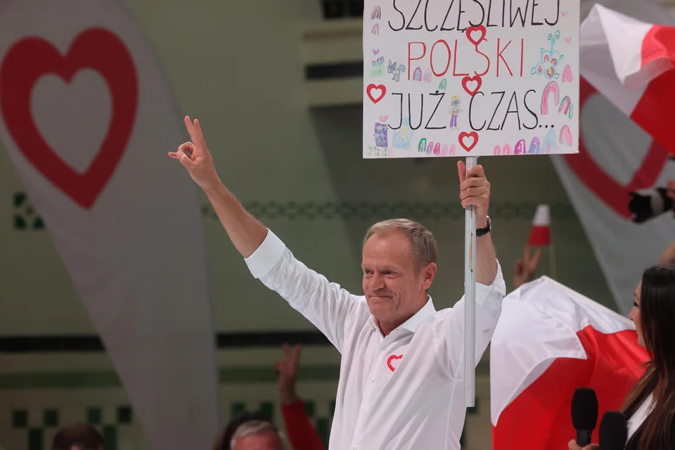 Poland's opposition leader Donald Tusk campaigning on Oct 10. The parliamentary elections, scheduled on Oct 15, is being closely watched as it is believed that the result will influence pan-EU debates on various issues.  