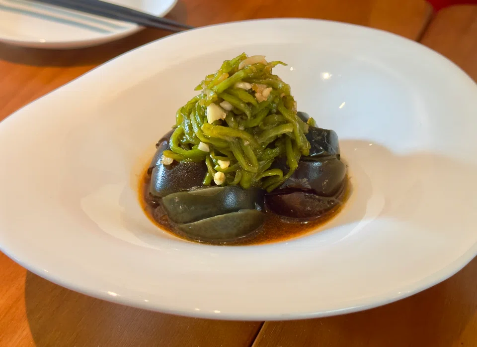 Century eggs with grilled green chillies.