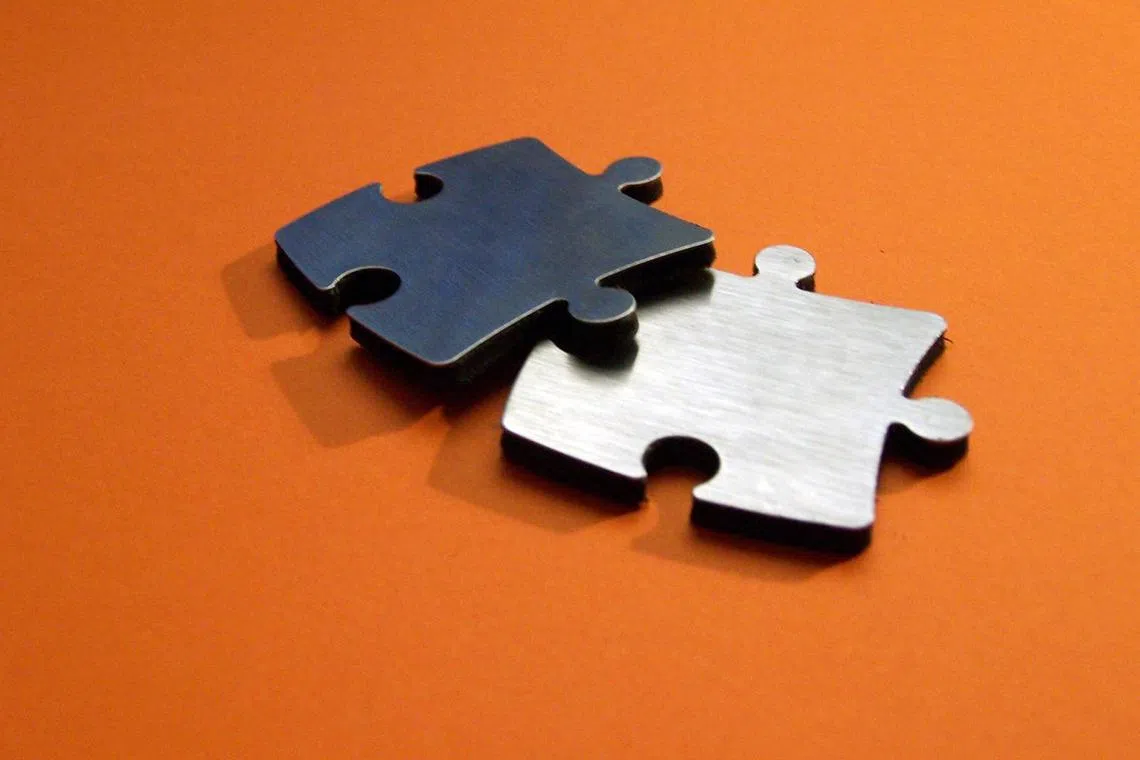 Photo illustration for the article “Mergers and acquisitions game not for the faint of heart ”.