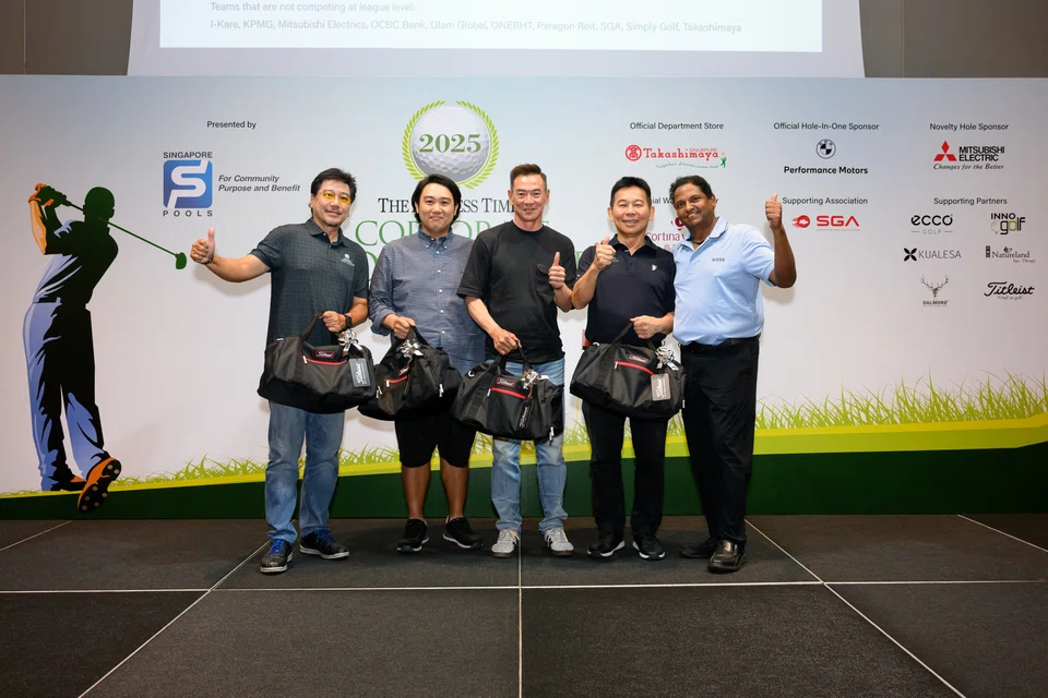 Singapore Global Trust's golfers (from left): Joey Chang, Kenneth Oh, Winson Oh and Tan Ah Ee, with them is The Straits Times managing editor Murali Subramaniam.