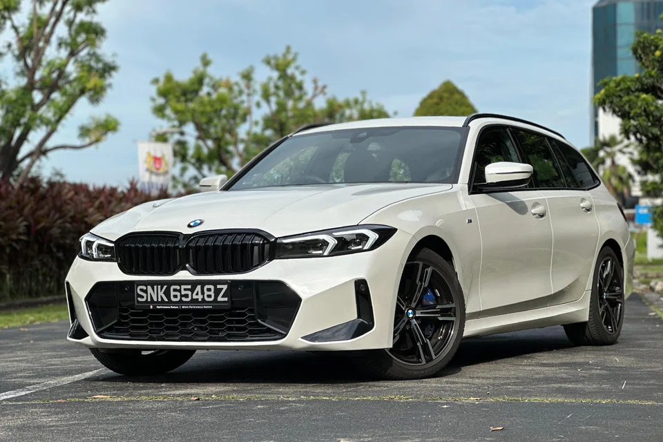 The BMW 330i Touring is rakishly good-looking and a treat to drive.

