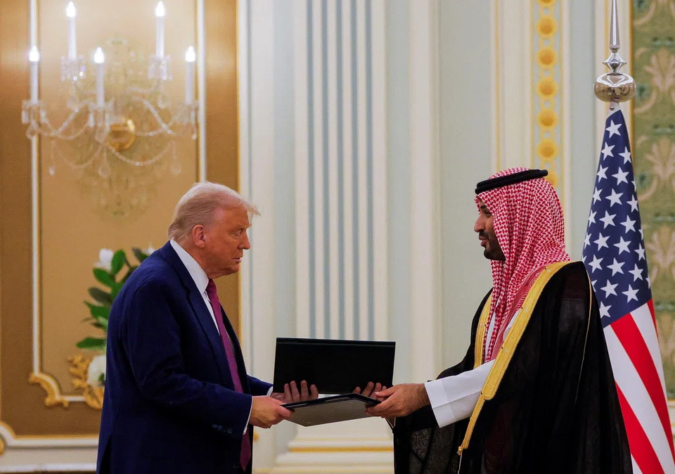 Prince Mohammed bin Salman (right) signed an agreement with US President Donald Trump which Saudi state television said covered energy, defence, mining and other areas.