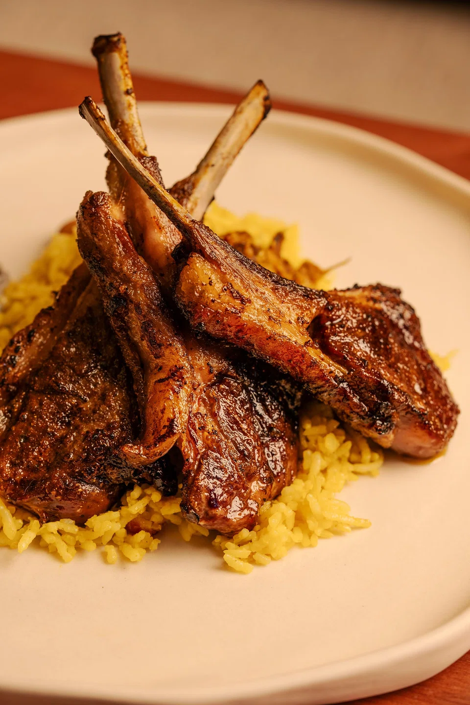 Heavily spiced rice and meaty lamb chop biryani.