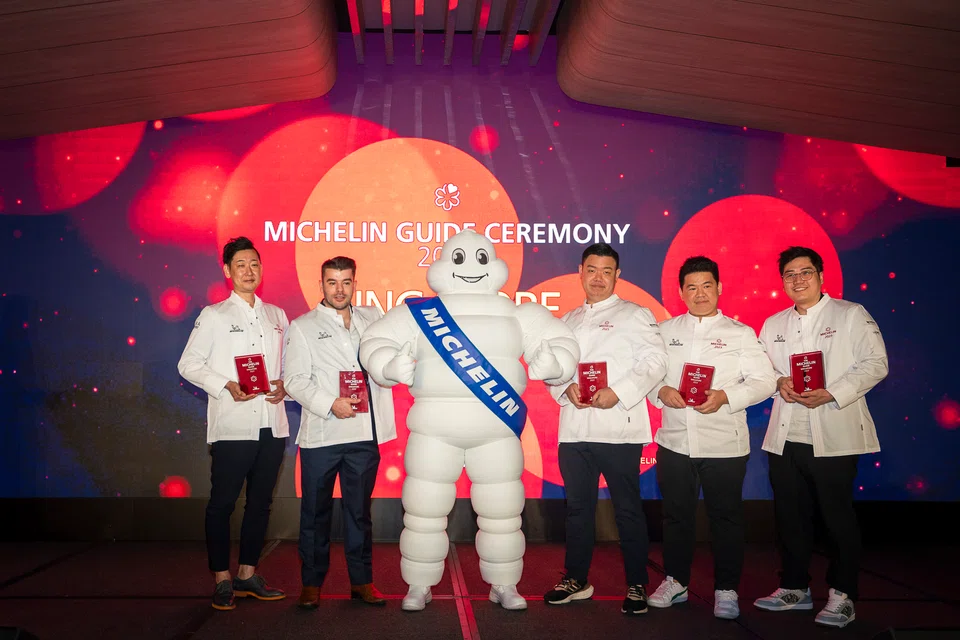 Standing with the Michelin Man are newly minted one-Michelin-star winners (from left) Yoshio Sakuta, Steve Lancaster, Kevin Wong, Zor Tan and Nicolas Tam.