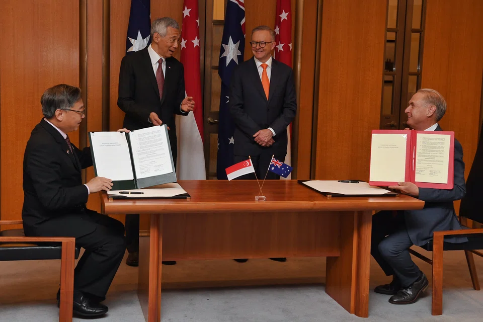 Singapore’s Minister for Trade and Industry Gan Kim Yong (left) and Australia’s Minister for Trade and Tourism Don Farrell signed the GEA in the presence of both prime ministers.