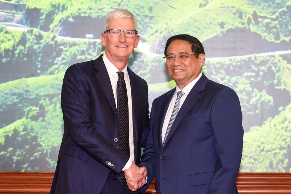 Vietnam's Prime Minister Pham Minh Chinh (R) meeting Apple CEO Tim Cook (L) at the Government Office in Hanoi on Apr 16, 2024. Apple is increasing its commitments to Vietnam by an unspecified amount.