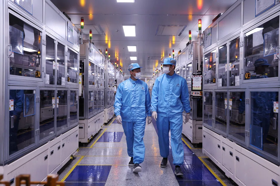 Employees at SK On EV battery factory in Seosan, South Korea, Oct 19, 2023. South Korean battery makers say that global automakers are now pressuring them to develop LFP batteries.
