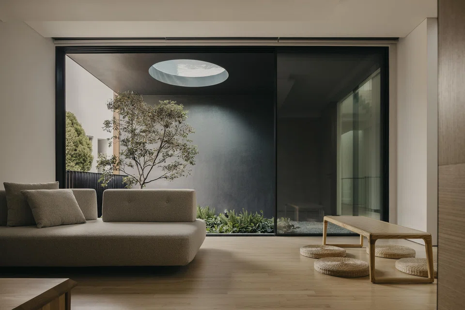 A tearoom-cum-family room with a courtyard view. 