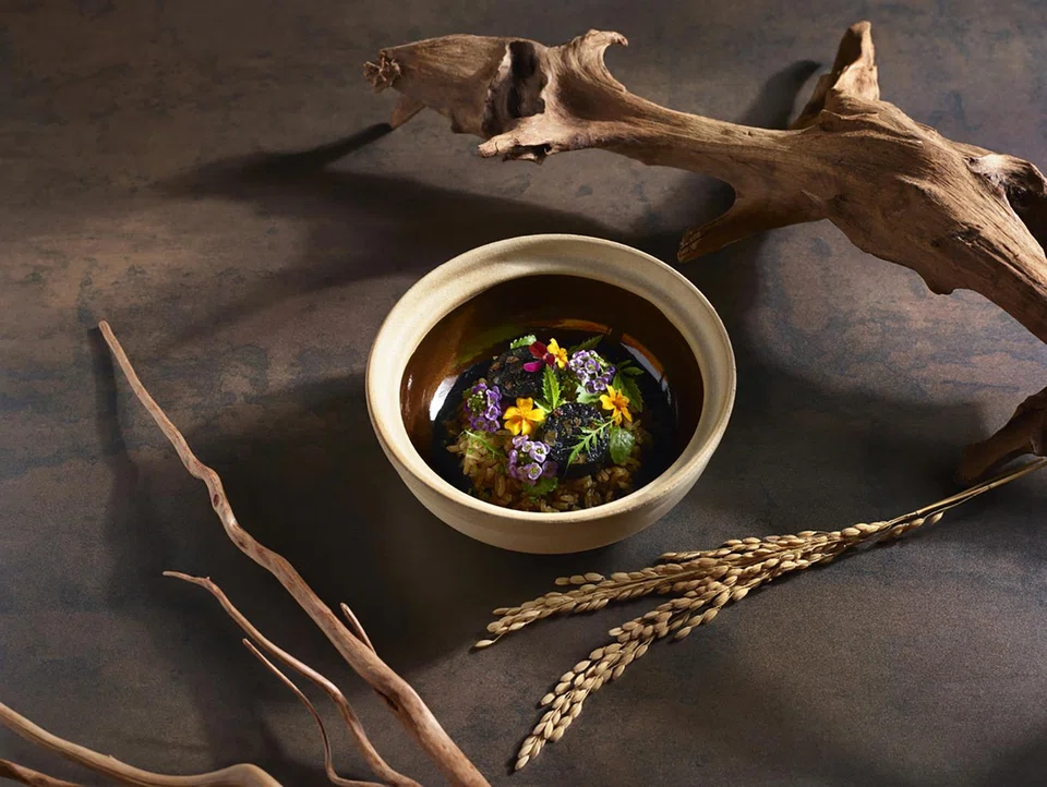 Claypot rice with squid sausage.