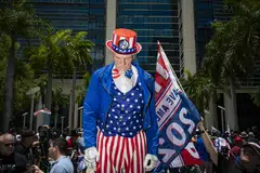 Supporters of former president Donald Trump, and protesters, outside a courthouse in Miami, on Jun 13, 2023. One of the biggest mistakes Americans would be making by electing Trump again is assuming that their country can skate by again without irreparable damage just because it survived his previous term, says the writer.