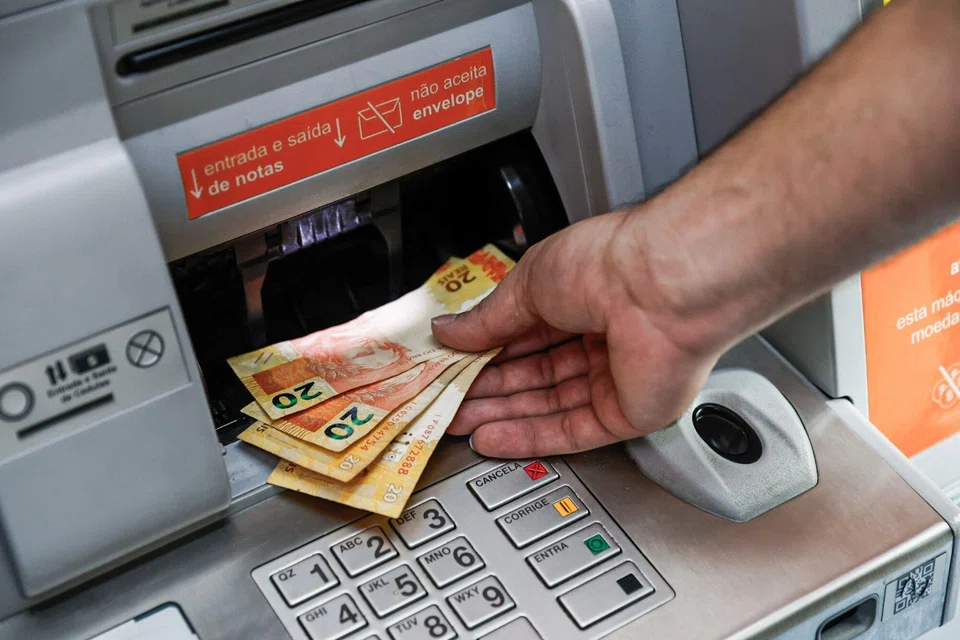 The Brazilian real sank overnight to a lifetime low, prompting the central bank to sell dollars via a spot auction.