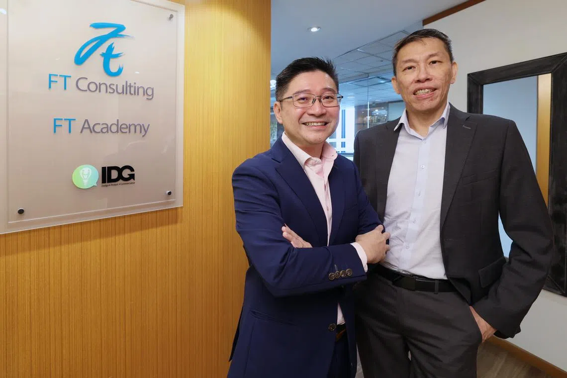 FT Consulting CEO Winston Chan (left) and executive chairman John Ong.