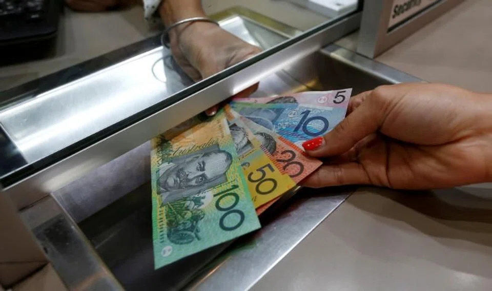 Gathering gloom about prospects for the global economy lifted the safe-haven dollar on Friday and pressured risk-sensitive currencies, with the Australian dollar tumbling to a two-year low.