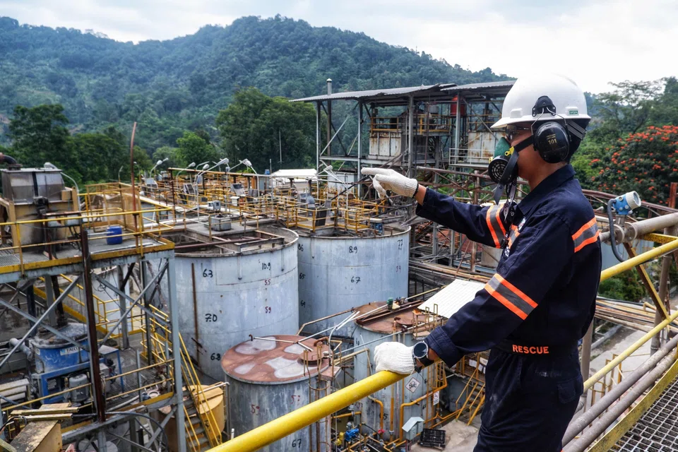 A worker gestures at the gold processing plant of PT Aneka Tambang Tbk (ANTAM)’s Pongkor underground gold mine in Bogor, West Java, Oct 16, 2025. The biggest beneficiaries of FDI into Indonesia in the July-September period were the base metal, mining, transportation, warehouse and telecommunication industries.