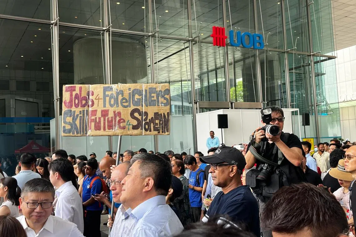 Attendees at Tuesday's lunchtime rally, held at UOB Plaza's promenade.