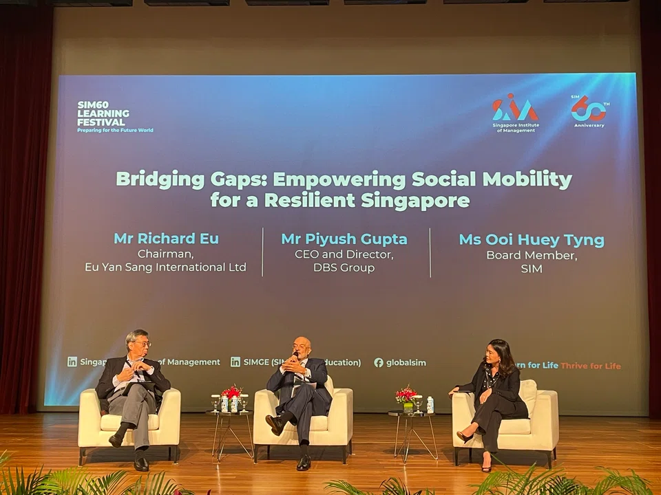 From left: Richard Eu, chairman of Eu Yan Sang International; Piyush Gupta, DBS chief executive and director; and panel moderator Ooi Huey Tyng, board member at SIM.
