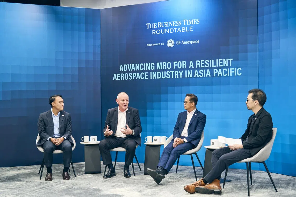 From left: Zheng Jingxin, Singapore Economic Development Board's vice-president of mobility and industrial solutions; Iain Rodger, GE Aerospace's managing director of component repair in Singapore; Yip Hin Meng, ST Engineering's executive vice-president and head of aerospace MRO; Derryn Wong, The Business Times' correspondent. 