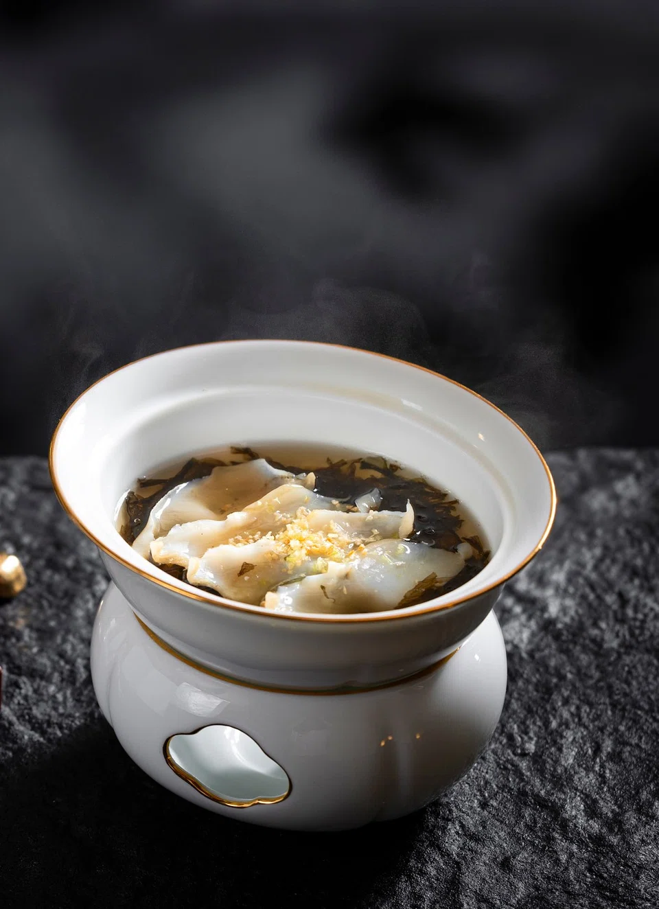 Double-boileDouble-boiled geoduck soup with seaweed.d geoduck soup with seaweed.