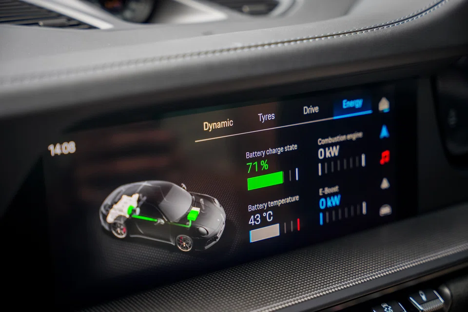 The 911 GTS’ main touchscreen lets you watch the hybrid motor and flat-six engine pass power back and forth in real time.