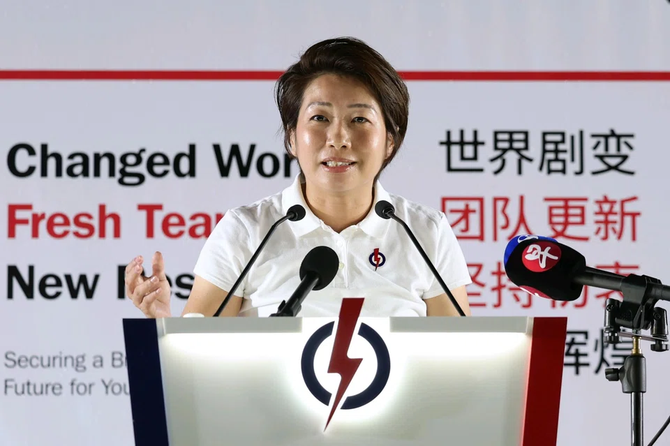 PAP's Gho Sze Kee speaking at a rally on Apr 30.  She is an associate director of boutique law firm AsiaLegal.