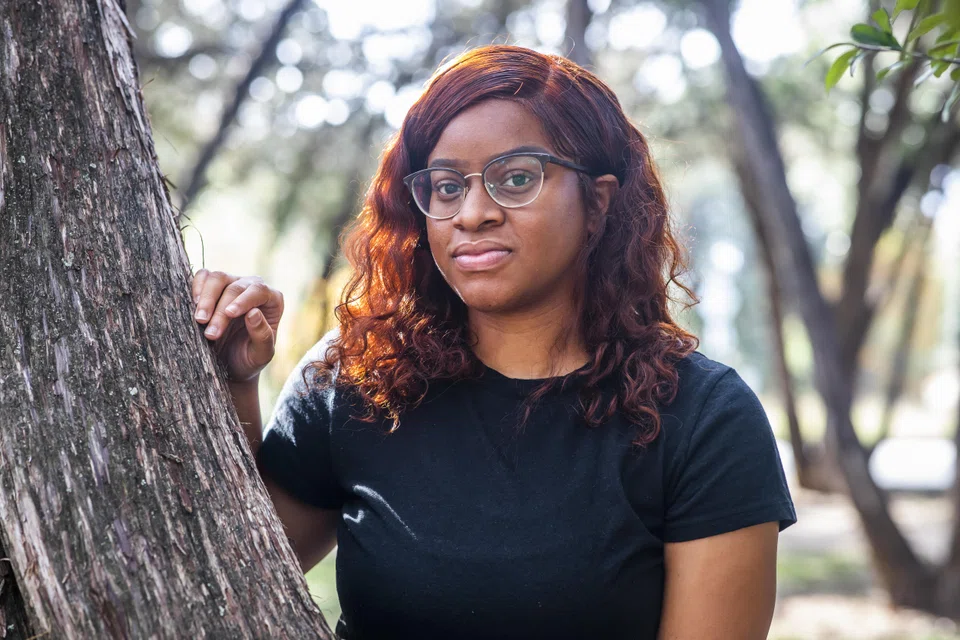 Alexis Carr, a University of Texas at Austin graduate, is looking for her first full-time job, focusing on mental health non-profits, and saving up by working as a server at an Italian restaurant. 