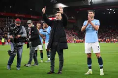 Manchester City manager Pep Guardiola gestures towards fans after the English Premier League match between Liverpool and Manchester City in Liverpool, England, Dec 1, 2024. 