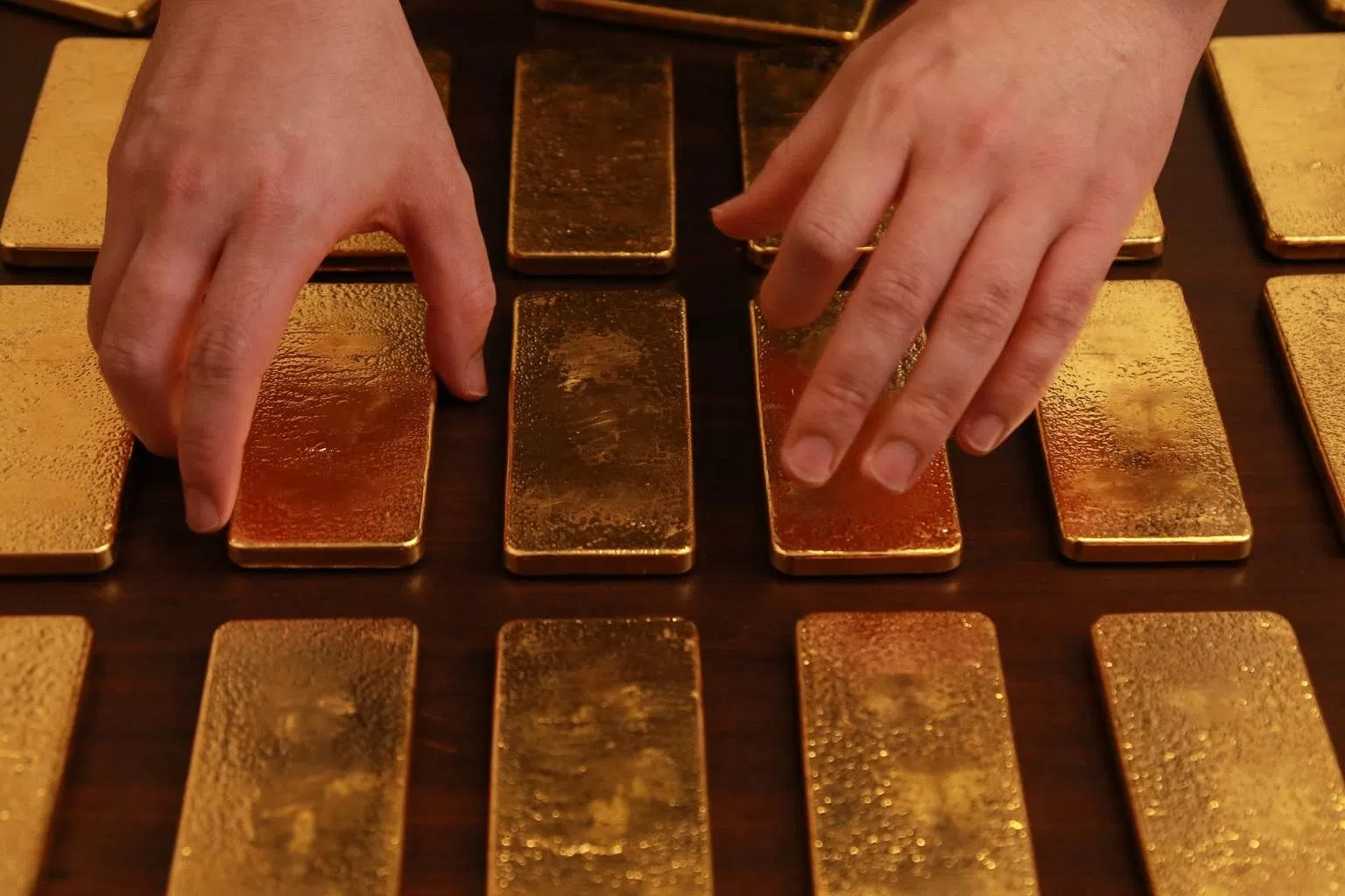 Gold steady as lower bond yields negate pressure from firm dollar