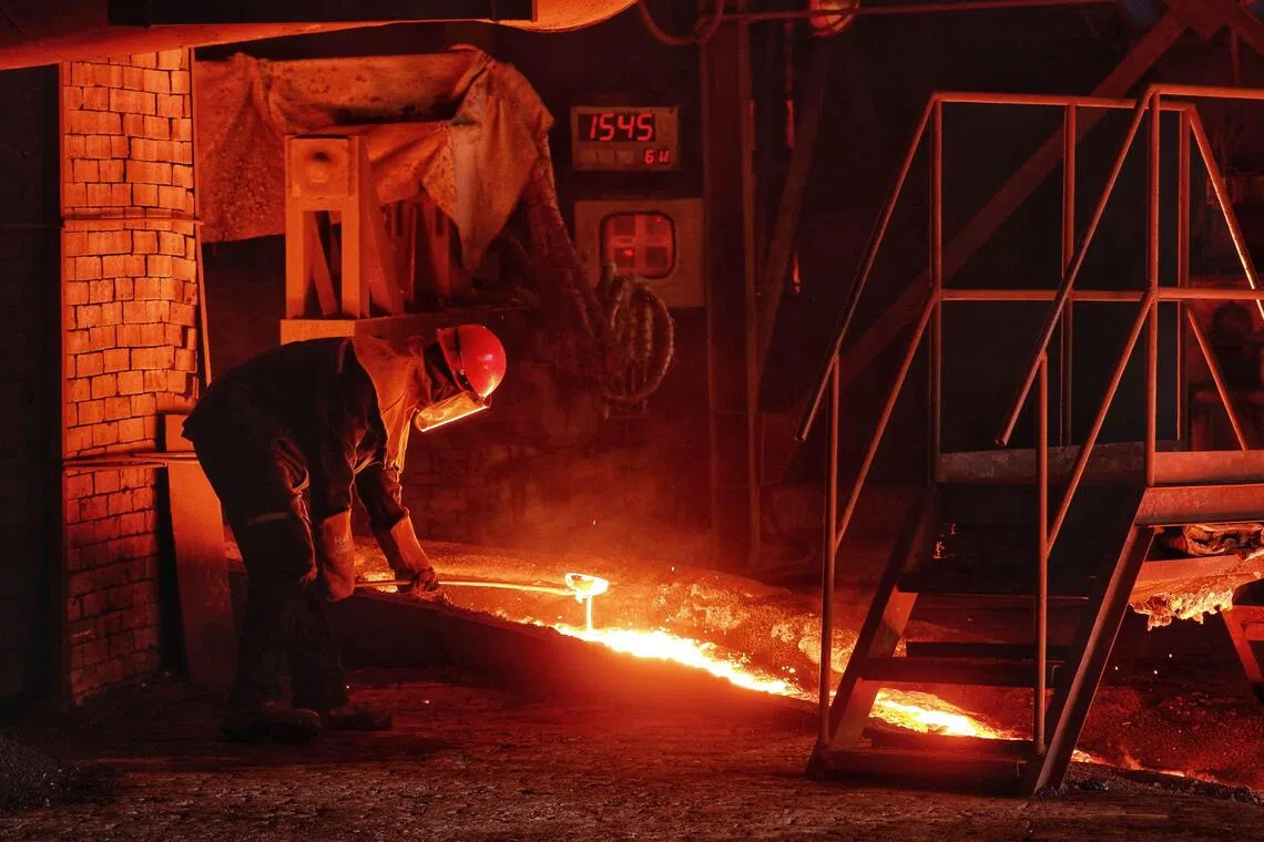 This picture shows an employee working at the smelter of Harita Nickel, one of Indonesia’s largest nickel producers, on Obi Island, South Halmahera, North Maluku, on September 16, 2025. (Photo by DAENG MANSUR / AFP)