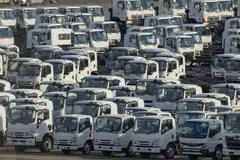 Isuzu Motors trucks bound for shipment at a port in Yokohama, Japan, Feb 6, 2025. The US passenger car tariff rate stands at 2.5 per cent currently, while a 25 per cent tariff is levied on highly profitable imported pickup trucks.