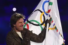 US actor Tom Cruise waves the Olympic flag during the closing ceremony of the Paris 2024 Olympic Games at the Stade de France on Aug 11.